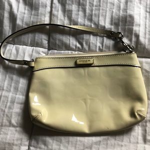 off white leather coach wristlet